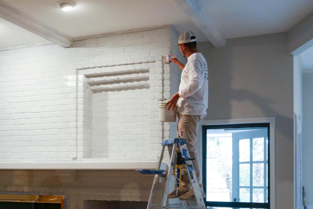 Professional interior painters in Fair Oaks, TX painting a house wall